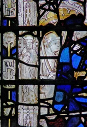 Window depicting a border panel with a figure
