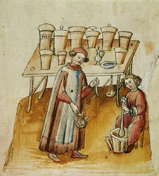 A pharmacist and his assistant pound herbs and roots for medical use, c.1380-1400