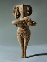 Nude Female Idol Holding a Tambourine