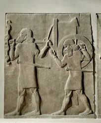 Servants carrying implements for the royal hunt