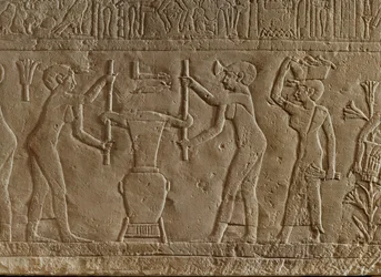 Women Pressing Flowers to Make Perfume