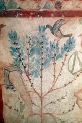 A bird sitting on a small tree (detail)