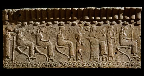Etruscan civilization: terracotta frieze adorned with low reliefs of divinities and seated dignitaries. 580 BC Dim. 24x54 cm. From Murlo Palace. Murlo, Antiquarium Comunale