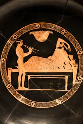 Cup: Symposiast and Young Slave Playing the Double Aulos