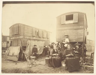 [Roma People Seated Outside Their Wagons]