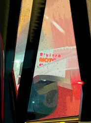 Rivera Motel Sign Seen from Car on Rainy Night