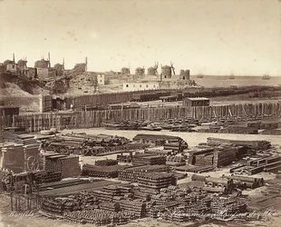 Yard for construction materials, windmills are in the background, in Alexandria, Egypt