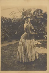 Woman with a Racket in a Garden