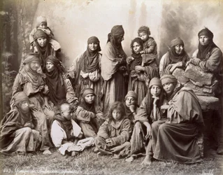 Portrait of a group of Syrian Bedouins in humble ethnic dress