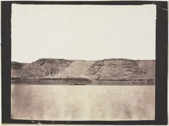 General View of Monuments Carved into Bedrock with Photographer