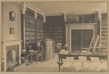 [Man Reading in a Library]