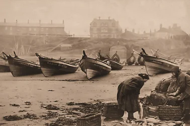 Women loading fish into baskets from the fishing boats, Whitby Harbour