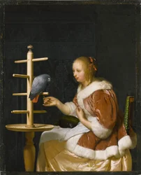 Young Woman Feeding a Parrot
