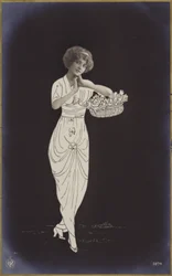 A Young Woman Carrying a Basket of Flowers