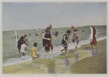 Children playing with a rope at the beach