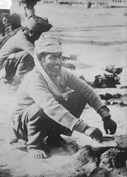 Indian soldier cooking in France