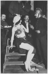 Mata Hari in the wings with a fireman, c.1905