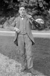 Portrait of a Horn Player, of the Band of Bourmont en Haute Marne, in the Garden of the Abbey of Septfontaines. Photography Late 19th Century. Ducos Collection