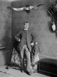 Portrait of a young man, posing in the Abbey of Septfontaines, near Bourmont en Haute Marne. Photography late 19th century. Ducos Collection.