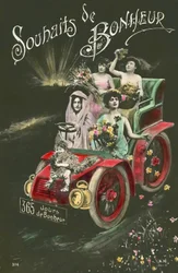 Women throwing flowers from a motor car