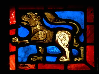 A corner piece depicting a lion, from the Passion window