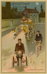 Acetylene headlights on a motor car and a motorcycle