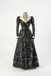 Black Figured Silk Dress with High Neck Chemisette of Cream Lace, Early 1890s