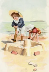 Boy and Girl Building Sand Castles