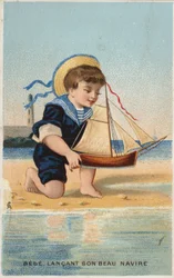 Boy Playing with Toy Sailing Boat