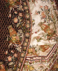 Detail of a magnificent suit of brown cut velvet, comprising coat, breeches & waist of ivory satin embroidered en suite, c.1760