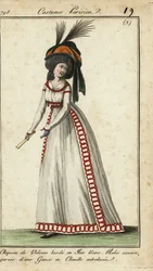 Fashionable woman with fan in huge hairstyle and hat