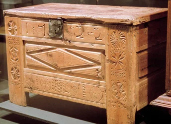 Carved peasant chest used to store linen