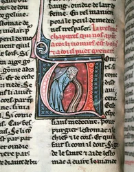 Historiated initial depicting a man vomiting