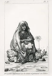 Rene Caille pondering over the Koran and taking notes, from Journal d