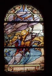 St Guénolé, Abbot of Landévennec, saves King Gralon during the flooding of the town of Ys - stained glass windows of St Germain church in Kerlaz