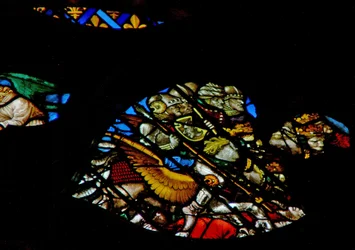 The west rose window depicting a scene from the Book of Revelation: Some of the two hundred million warriors destroying a third part of humanity