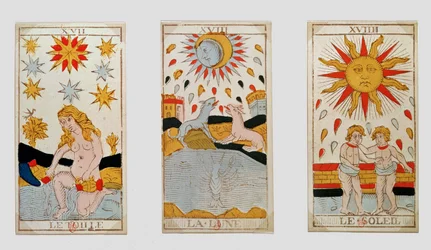 Three tarot cards depicting The Star, The Moon and The Sun