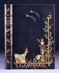 Upper book cover of two shooting-stars, a torch, foliage, faun on pedestal, putto and a leg behind a fan, 1893