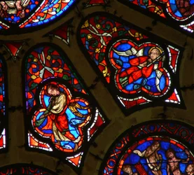 Window depicting angels, one with Passion Instrument the other with trumpet