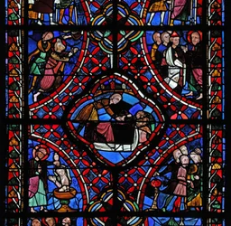 Window depicting the third section of the St James window: not all of the scenes have been identified, but a baptism can be seen and possibly the martyrdom of the saint