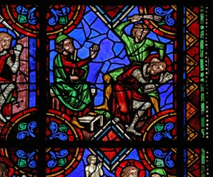 Window depicting St Julian of Brioude story - St Ferreol, a friend of Julien, who died during the Diocletian persecutions, is captured and beaten