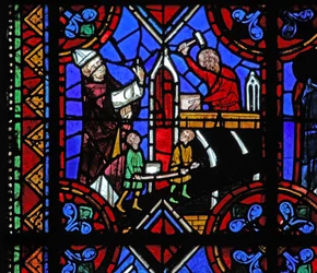 Window depicting the constructing of a church