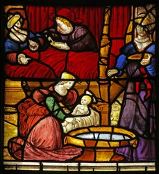 Window depicting the Life of St Remi. His birth at the chateau of Cerny-en-Laonnois