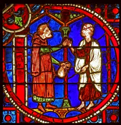 Window depicting a scene from the Theophilus story: he solicits the help of a magician