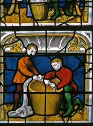 Window w25 depicting a draper at work in the Drapers window
