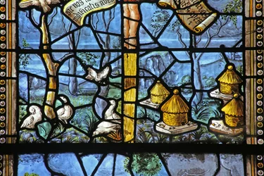 Window depicting Virgil-inspired country scenes beneath Christ on Cross