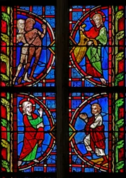 Window w30 depicting Adam and Eve given clothes