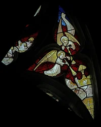 Window depicting musician angels with trumpets at Last Judgement