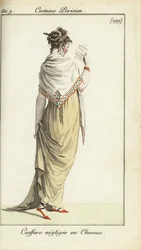 Woman in casual hairdo reading a fashion magazine