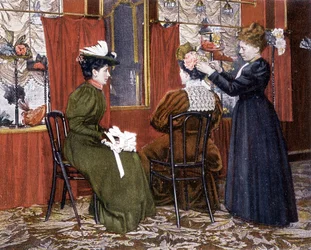 Woman styling a lady with a hat at the Maison Nouvelle